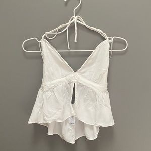 Light fabric, sheer everywhere but the boobs. Open back+slit to the bra section.